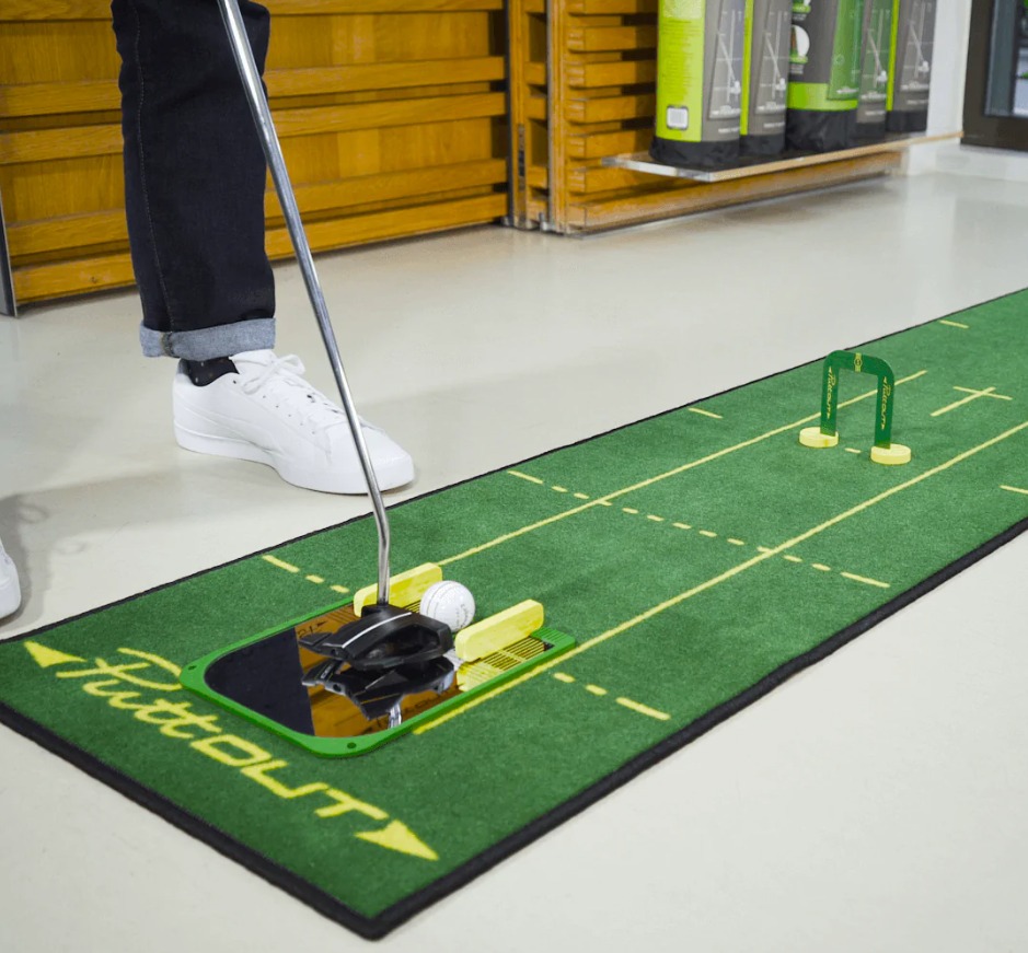 Golfer practicing putting routine at home